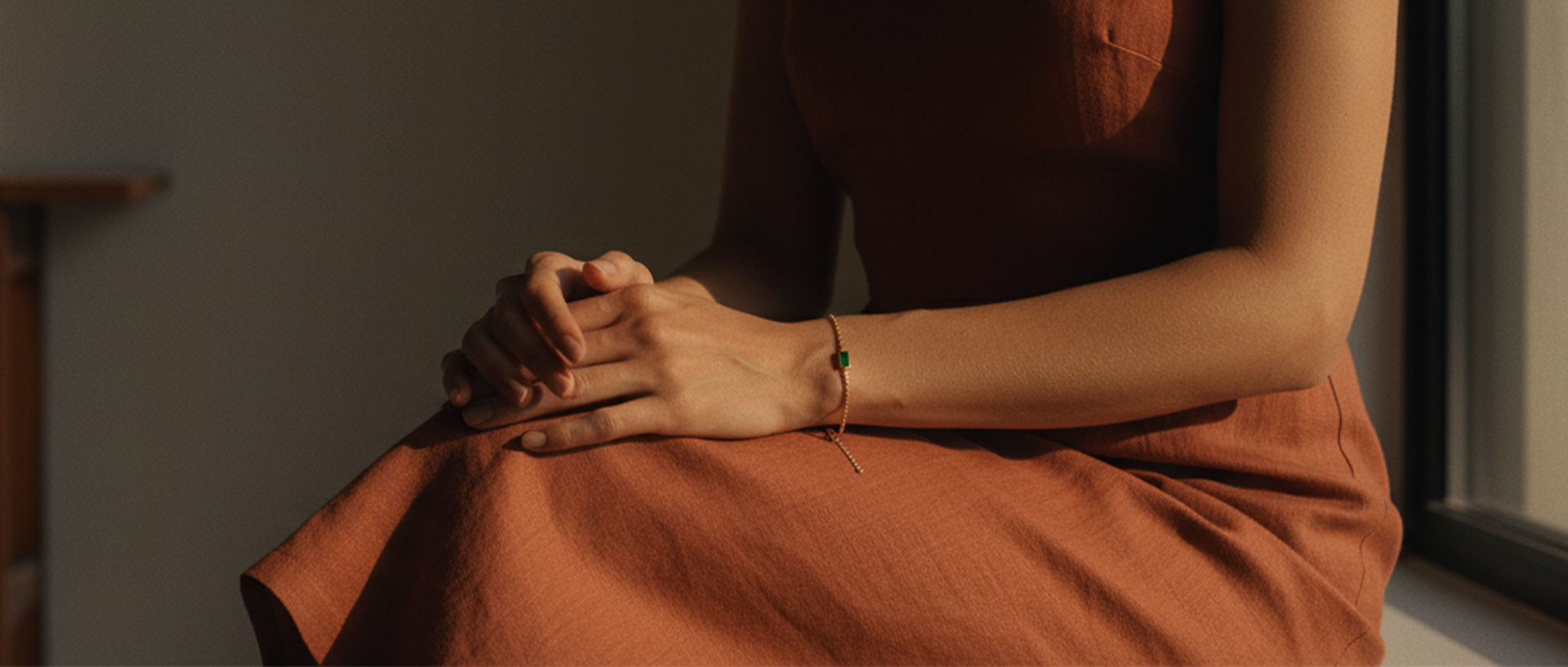 A cinematic shot of a woman wearing an Atelier Verde bracelet, embodying the quiet confidence of sustainable luxury.